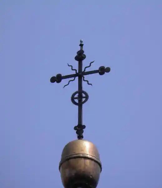 Cross on a solar disc on top of a steeple